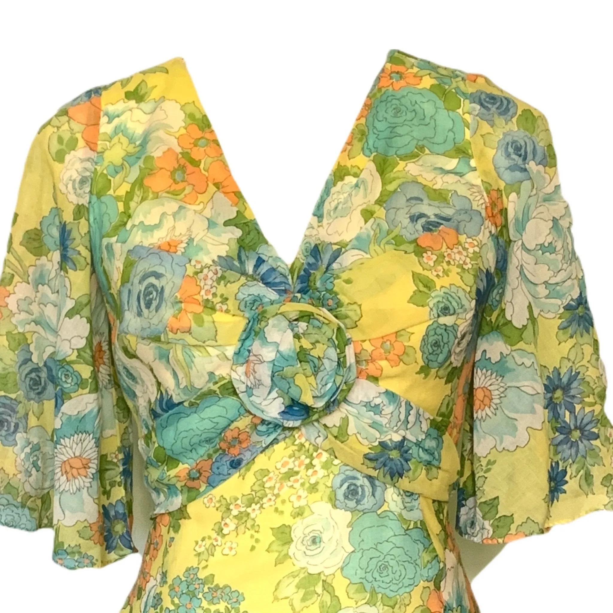 1960s Floral Summer Midi Dress by Miss Elliette with a Green, Blue and Yellow Floral Design.