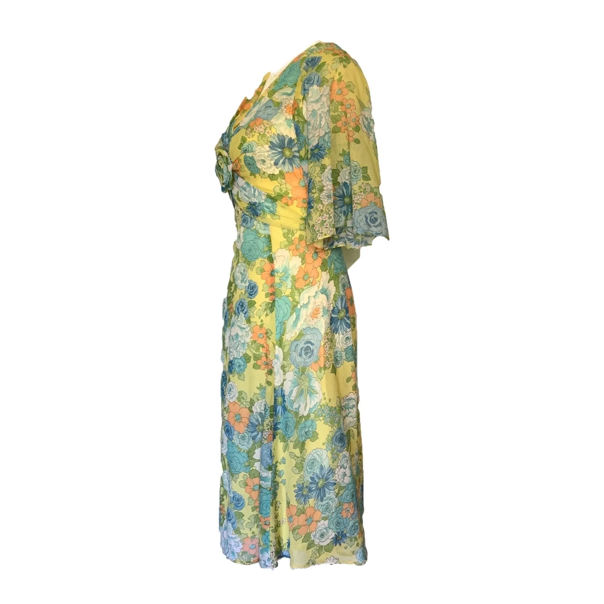 1960s Floral Summer Midi Dress by Miss Elliette with a Green, Blue and Yellow Floral Design.