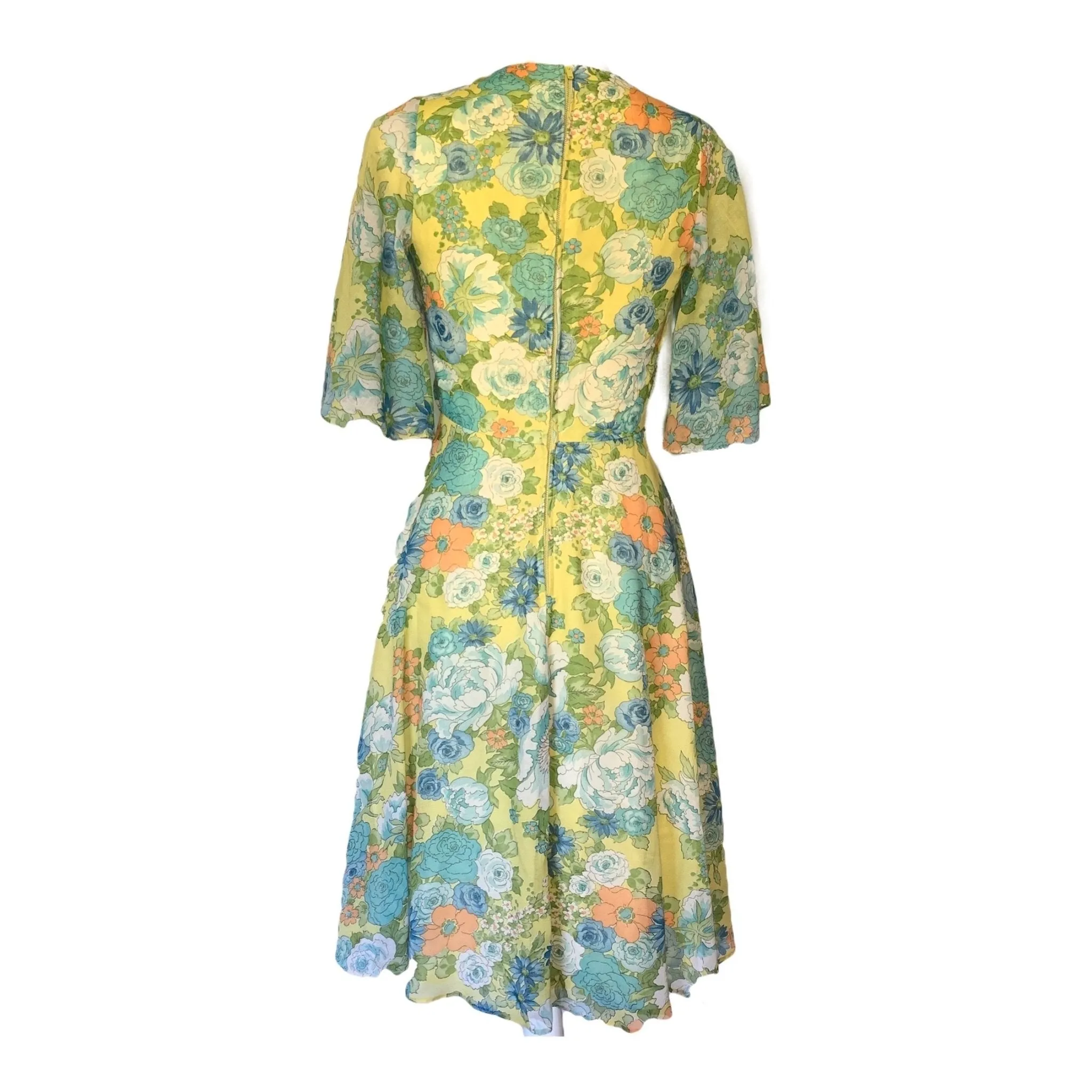 1960s Floral Summer Midi Dress by Miss Elliette with a Green, Blue and Yellow Floral Design.